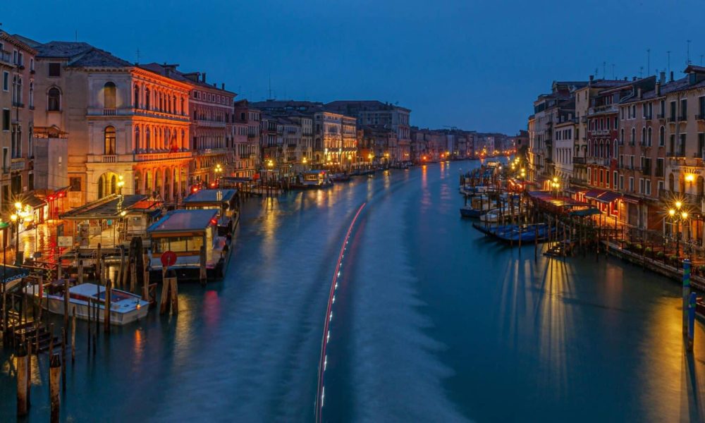 Discover the serene beauty of Venice's Grand Canal at twilight with its historic architecture and romantic ambiance.